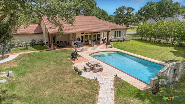 a view of a swimming pool with a patio