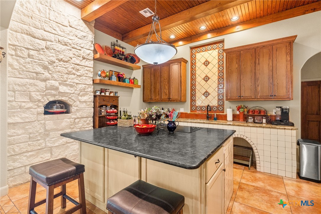 166 Post Oak Bend Inez, TX 77968 - Photo 9 of 48 a kitchen with stainless steel appliances granite countertop a sink stove and cabinets