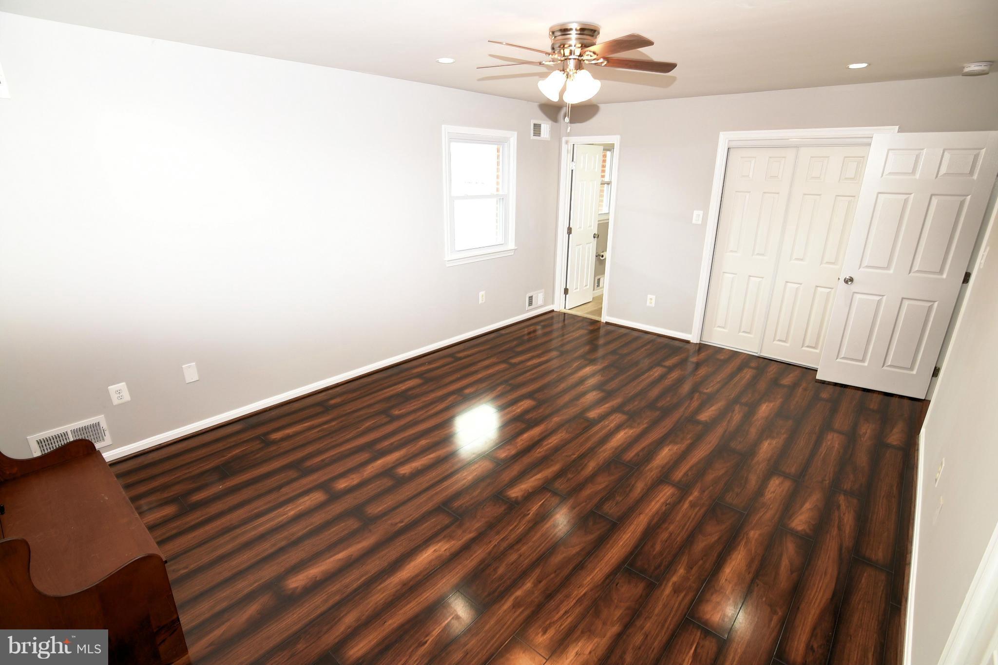 6504 Springbrook Lane Clinton, MD 20735 - Photo 18 of 30 wooden floor in an empty room