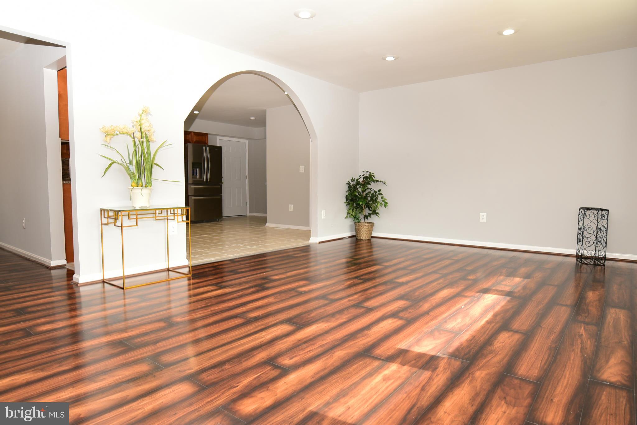 6504 Springbrook Lane Clinton, MD 20735 - Photo 3 of 30 a view of empty room with wooden floor