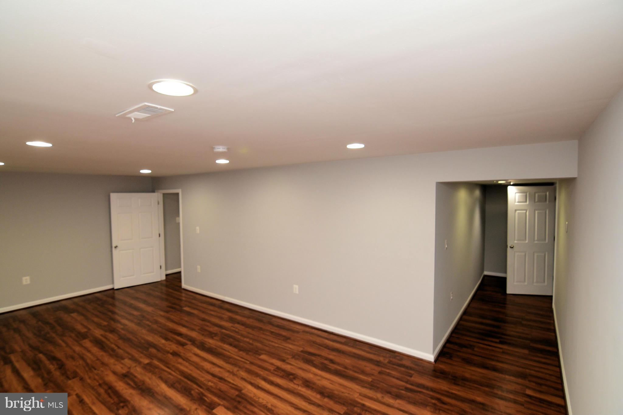 6504 Springbrook Lane Clinton, MD 20735 - Photo 29 of 30 wooden floor in an empty room with wooden floor