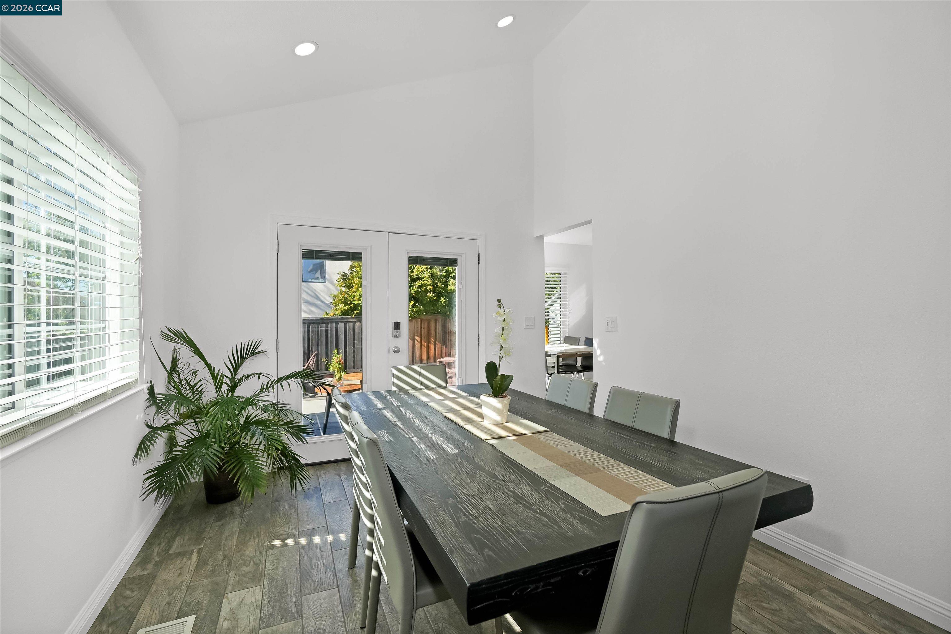 162 Woodfield Hercules, CA 94547 - Photo 11 of 59 a view of a dining room with furniture and a potted plant