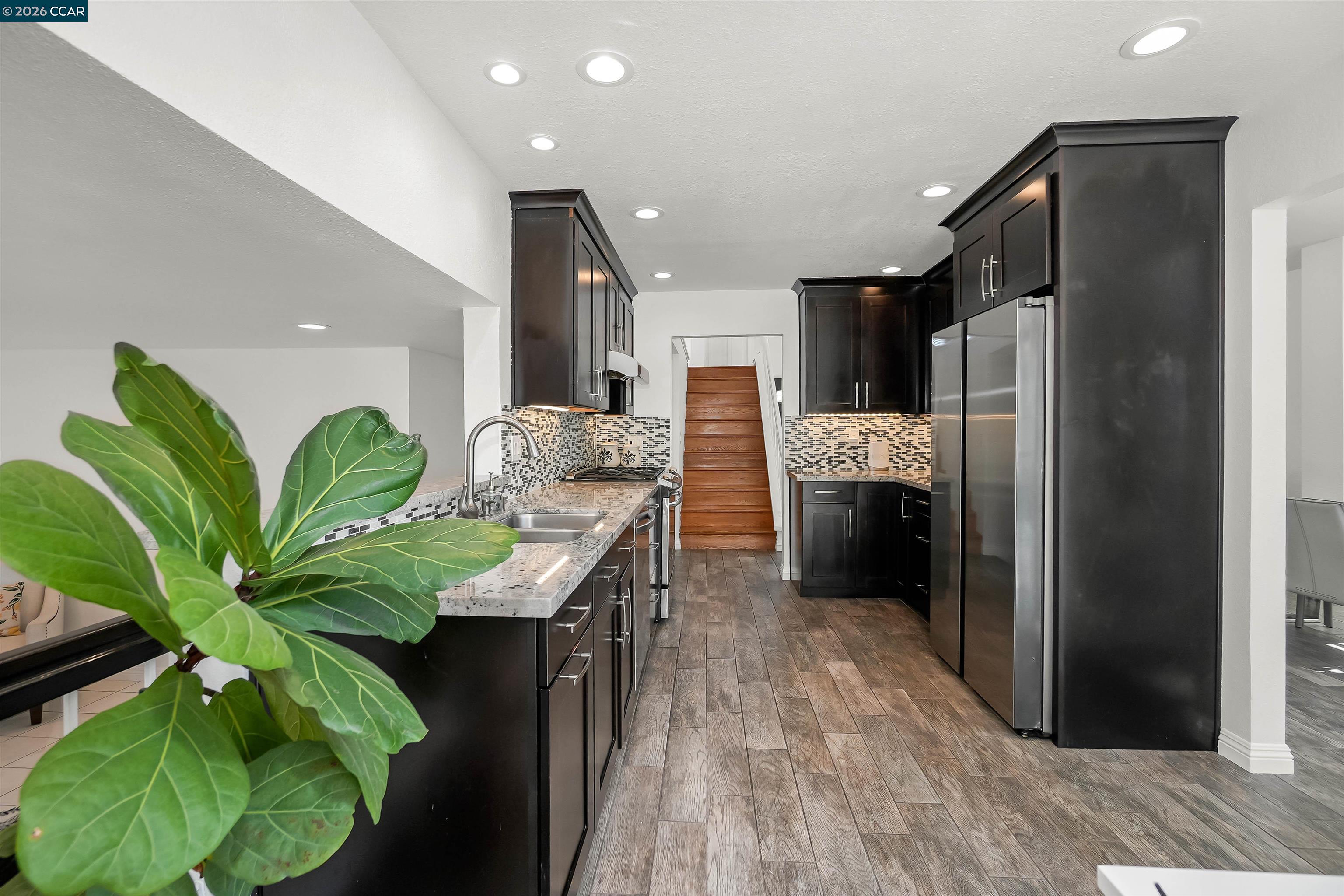 162 Woodfield Hercules, CA 94547 - Photo 16 of 59 a kitchen with stainless steel appliances granite countertop a refrigerator a stove a sink and a oven