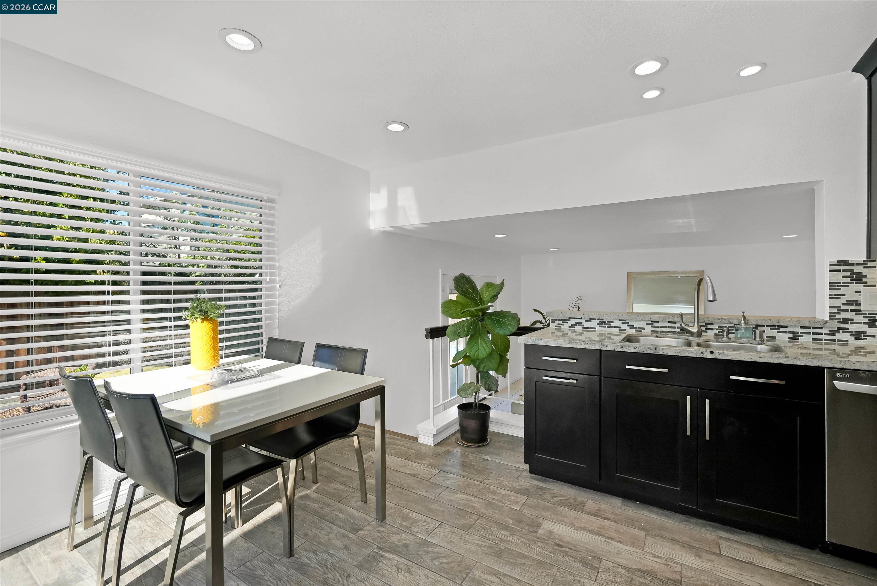 162 Woodfield Hercules, CA 94547 - Photo 18 of 59 a view of a kitchen with a table and chairs in it