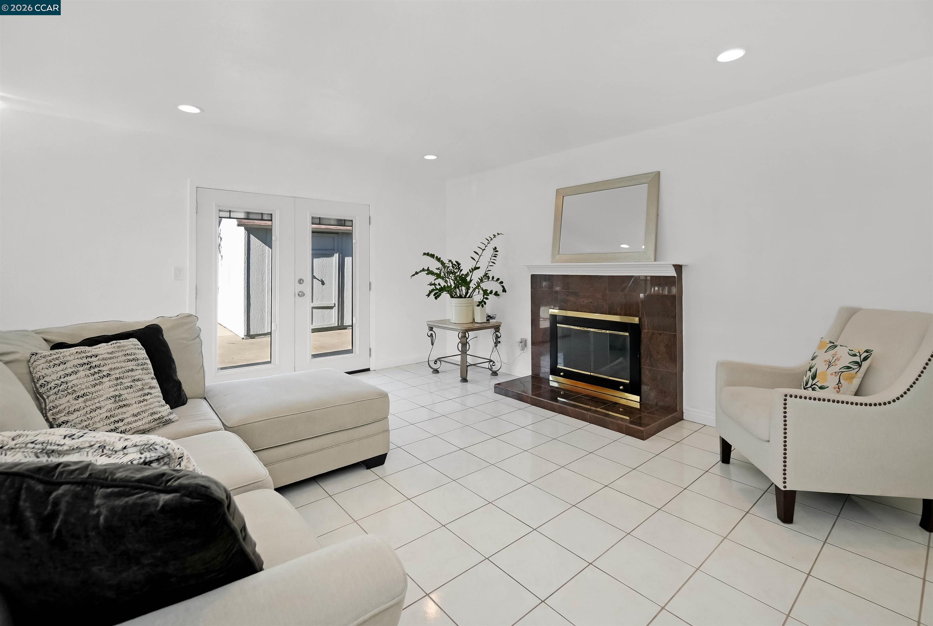 162 Woodfield Hercules, CA 94547 - Photo 23 of 59 a bedroom with furniture and a fireplace