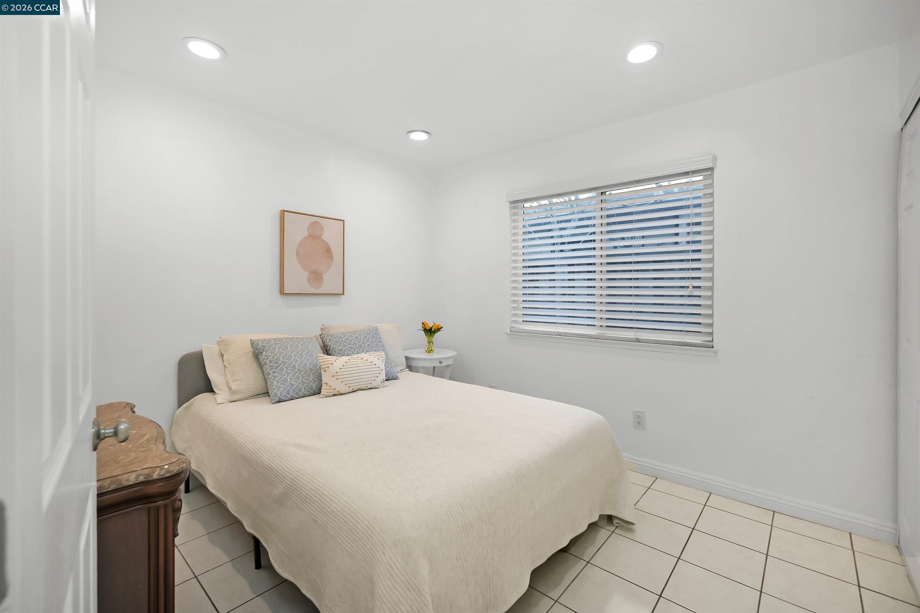 162 Woodfield Hercules, CA 94547 - Photo 25 of 59 a bedroom with a bed and a window