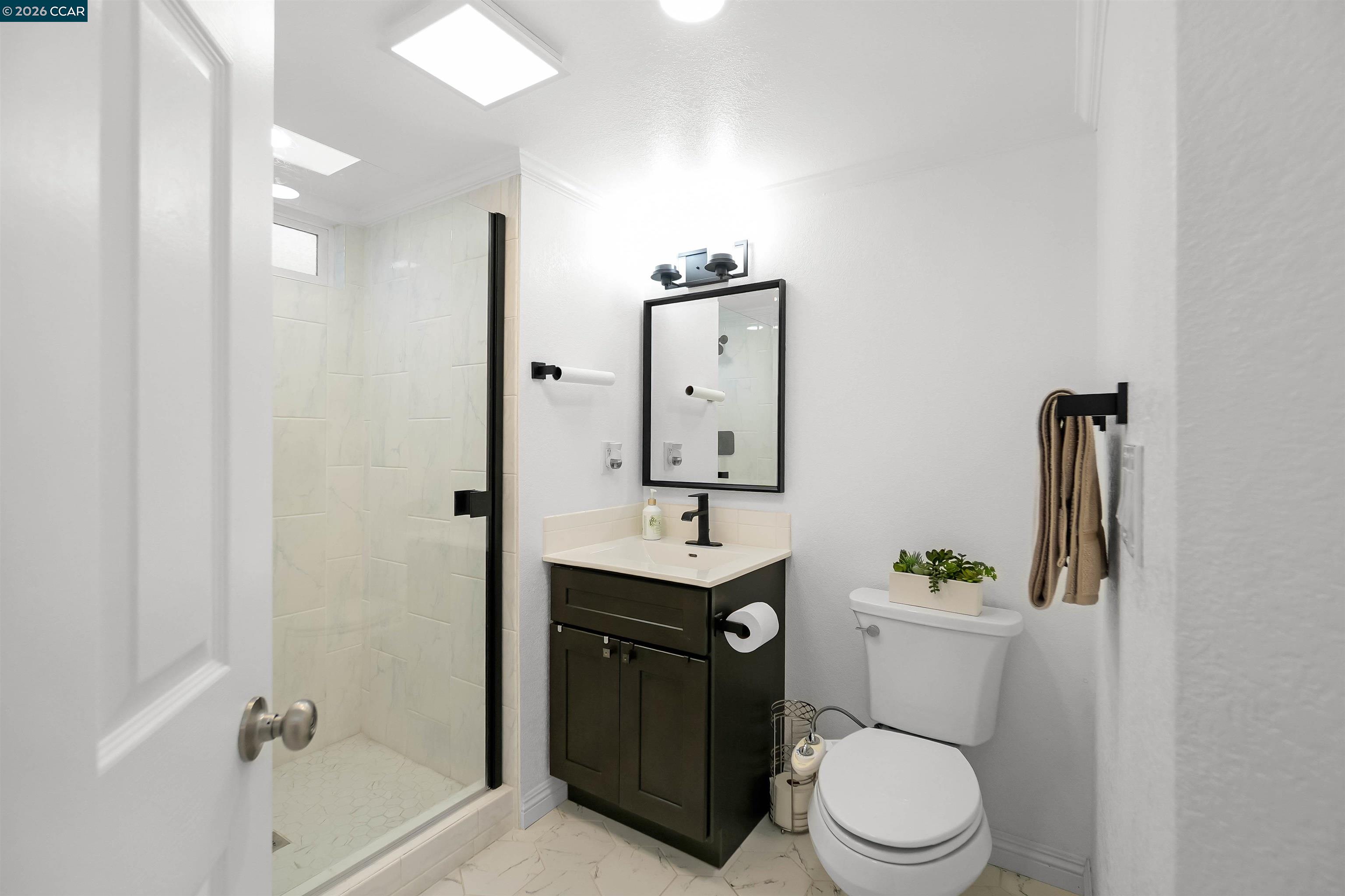 162 Woodfield Hercules, CA 94547 - Photo 26 of 59 a bathroom with a toilet sink vanity granite and shower