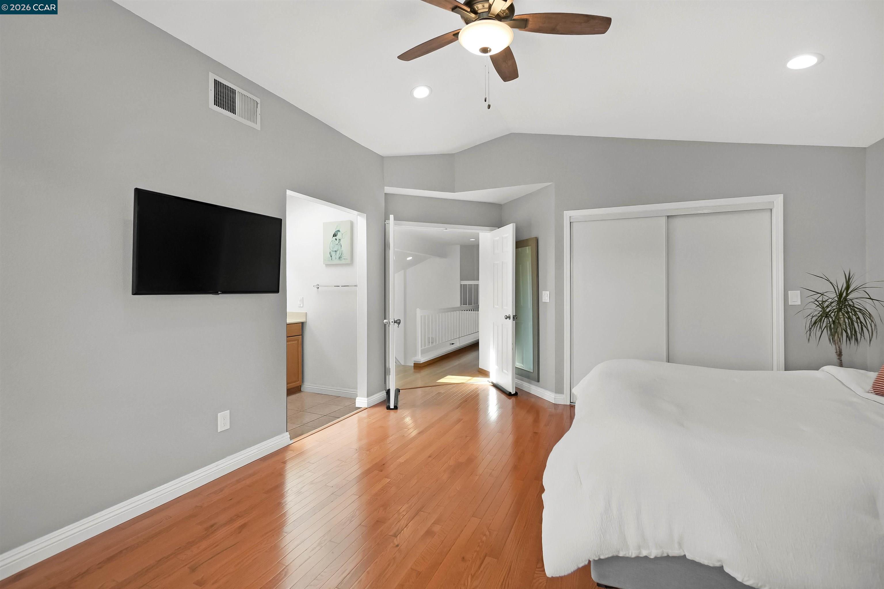 162 Woodfield Hercules, CA 94547 - Photo 33 of 59 a bedroom with a bed and a flat screen tv