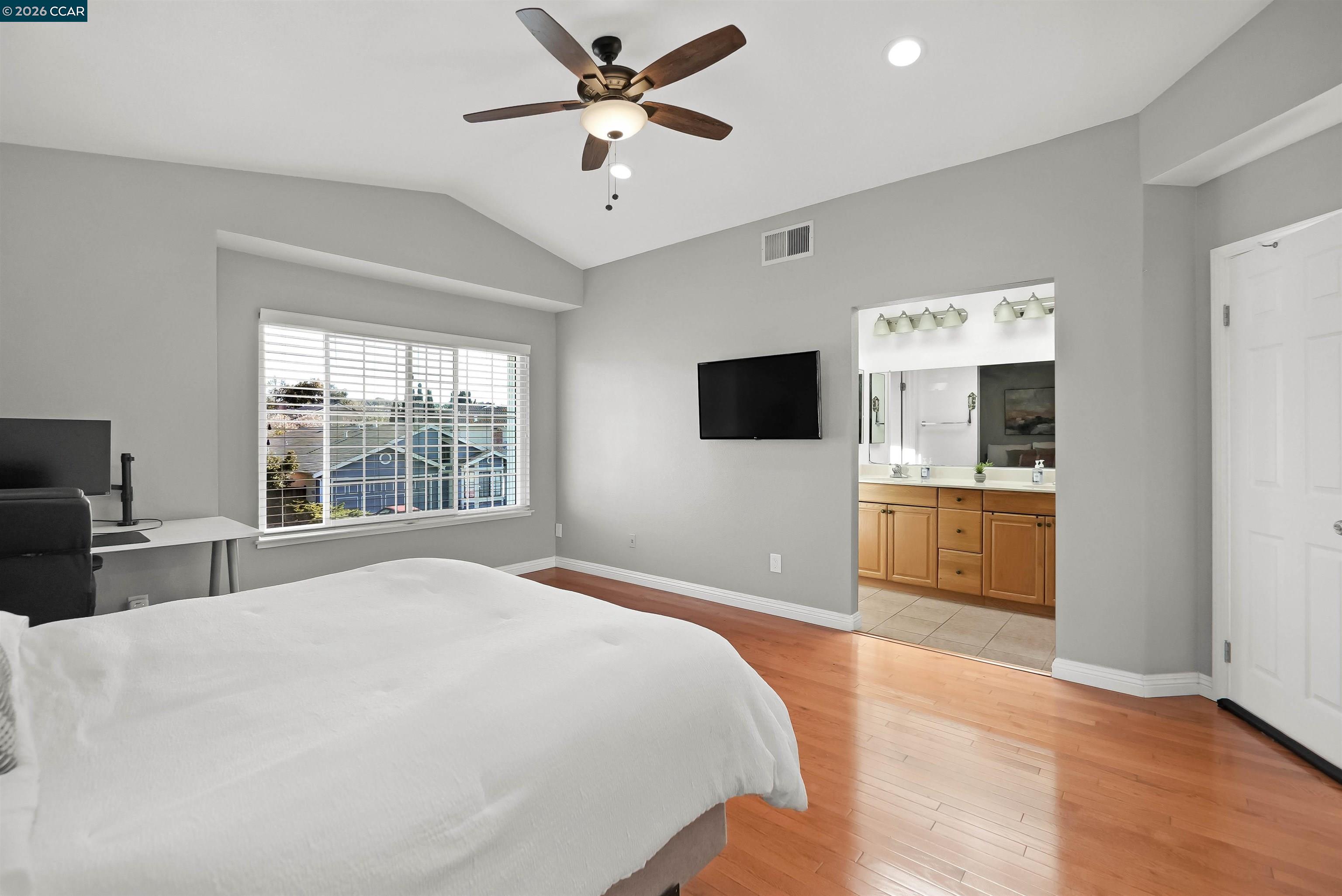 162 Woodfield Hercules, CA 94547 - Photo 34 of 59 a bedroom with a large bed and a flat screen tv