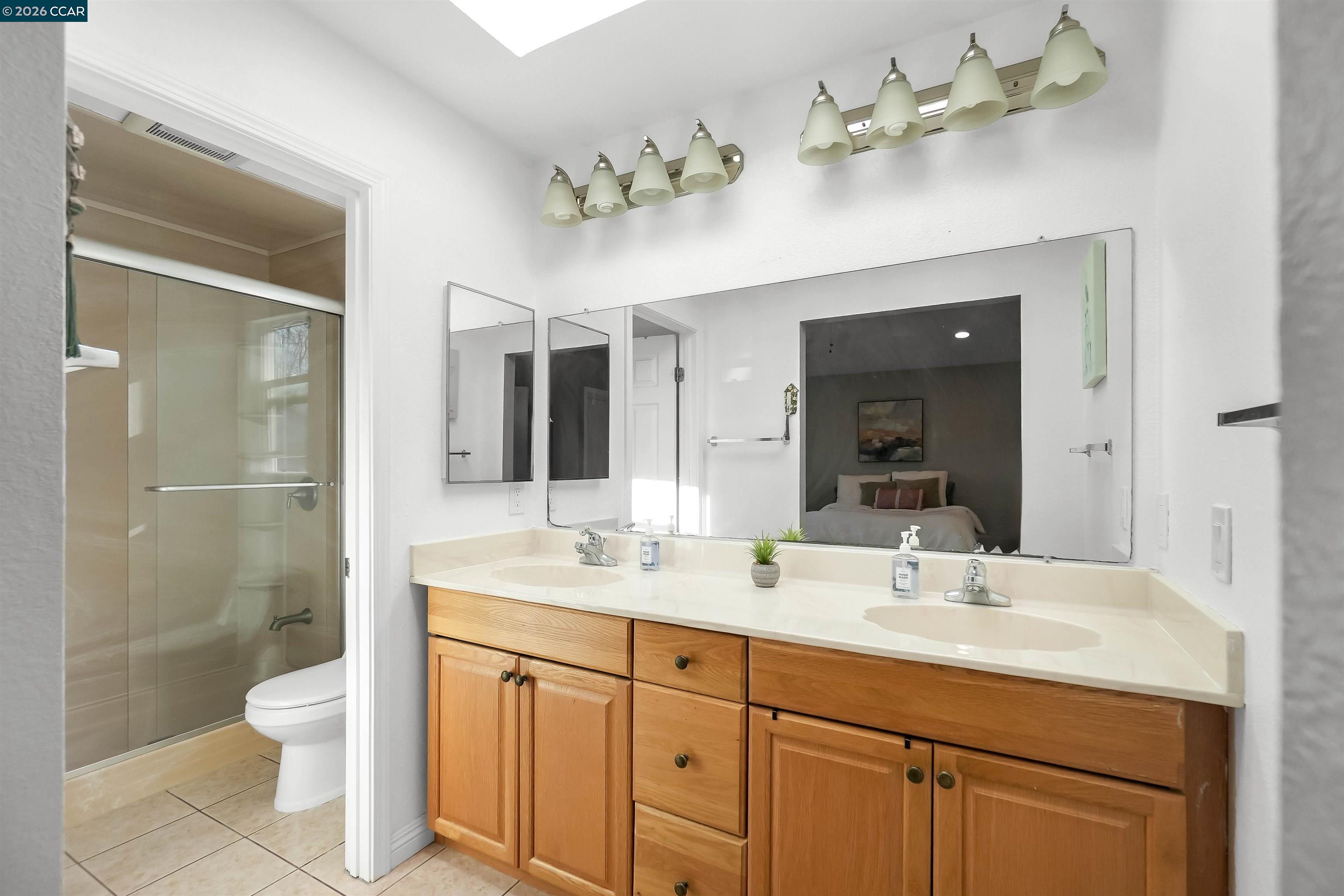 162 Woodfield Hercules, CA 94547 - Photo 35 of 59 a bathroom with a double vanity sink mirror and toilet