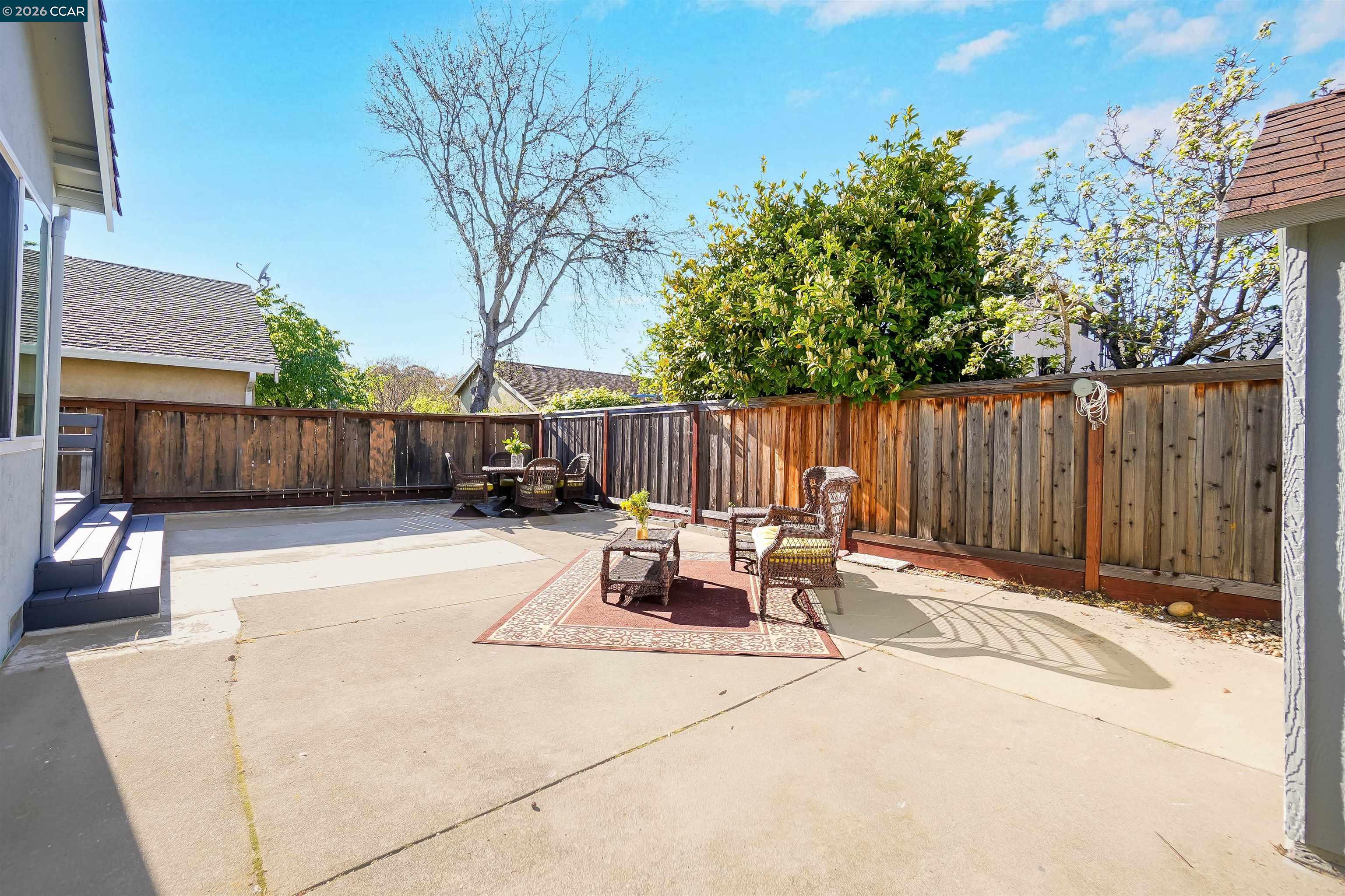 162 Woodfield Hercules, CA 94547 - Photo 45 of 59 a view of backyard with outdoor seating and trees
