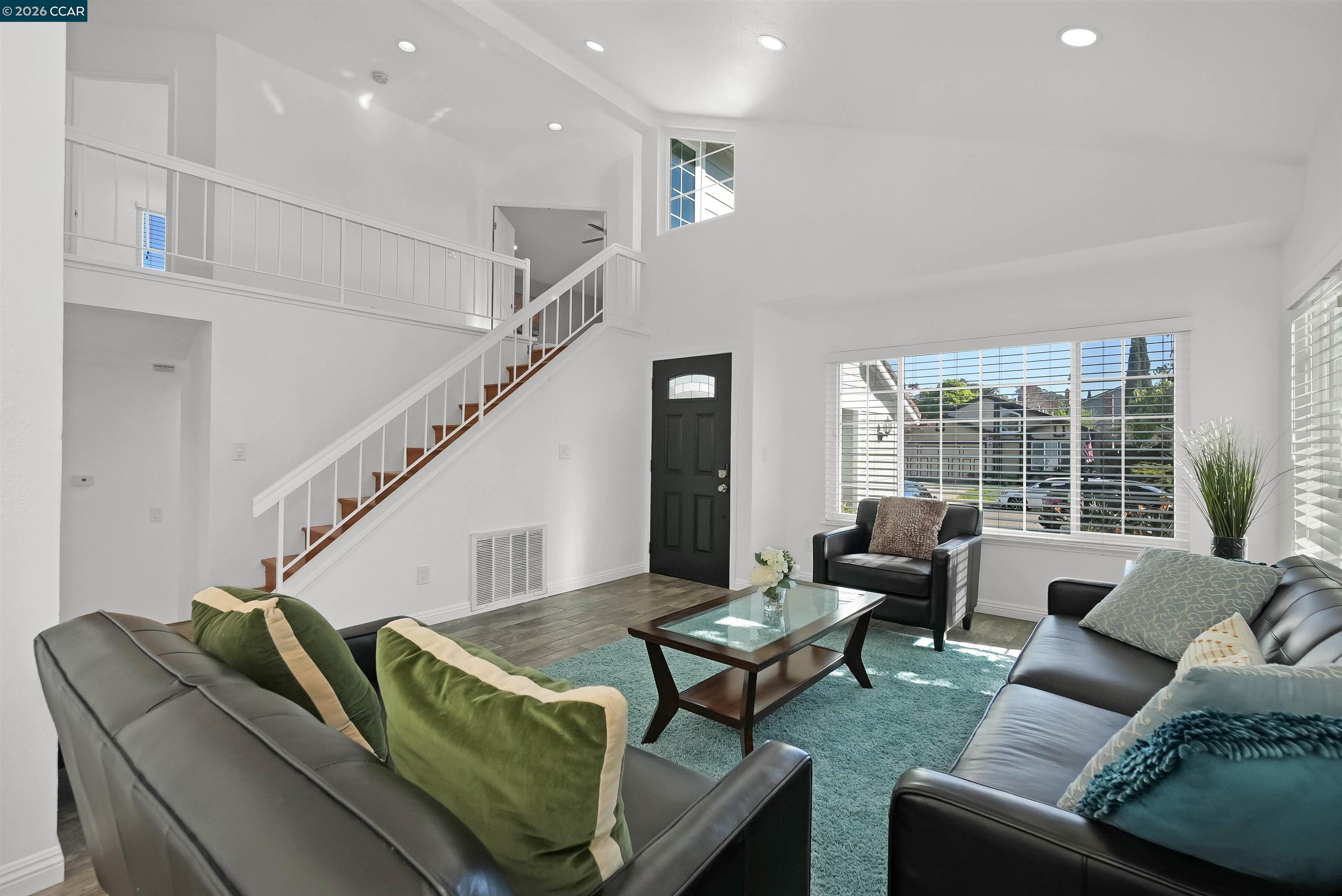 162 Woodfield Hercules, CA 94547 - Photo 9 of 59 a living room with furniture and a potted plant