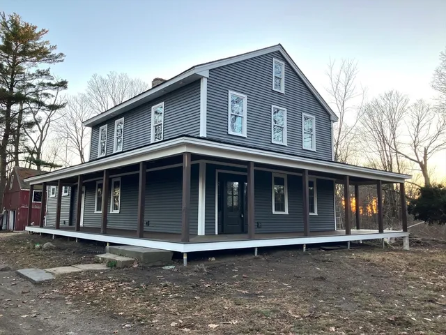 a front view of a house with a large window