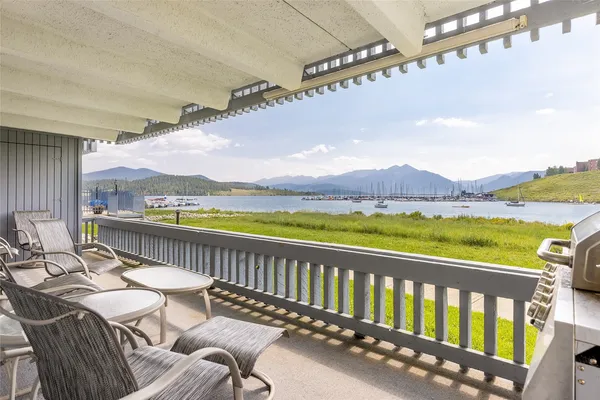 a view of a balcony with lake view and mountain view