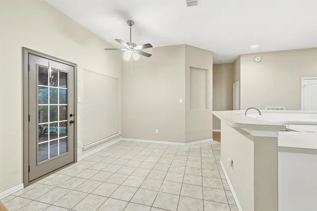 a kitchen with a sink and a refrigerator