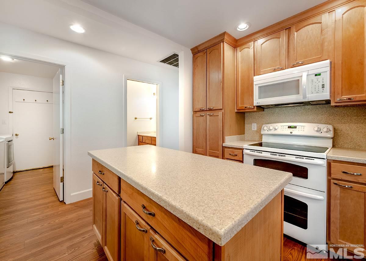 3115 Corey Drive Reno, NV 89509 - Photo 7 of 20 a kitchen with a stove a sink and a refrigerator