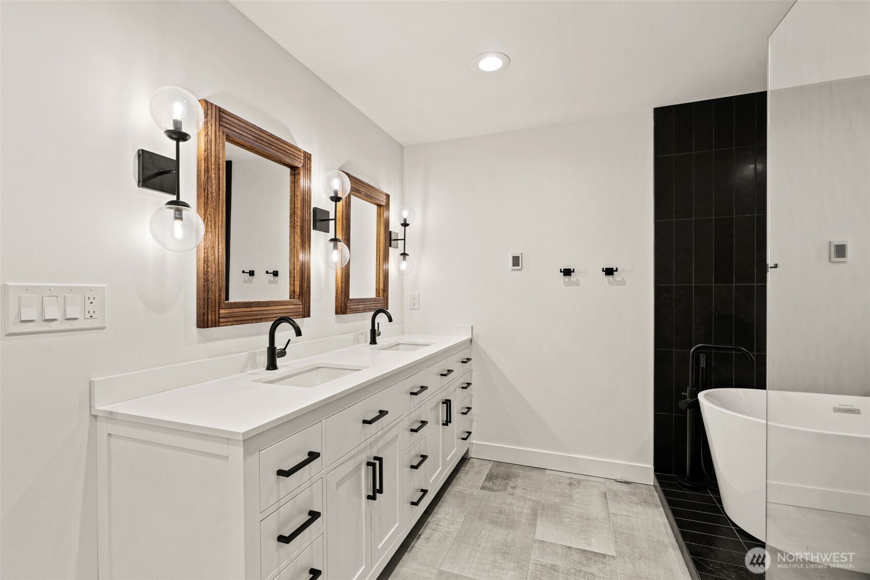 19125 94th Avenue West Edmonds, WA 98020 - Photo 18 of 37 a bathroom with a double vanity sink and mirror
