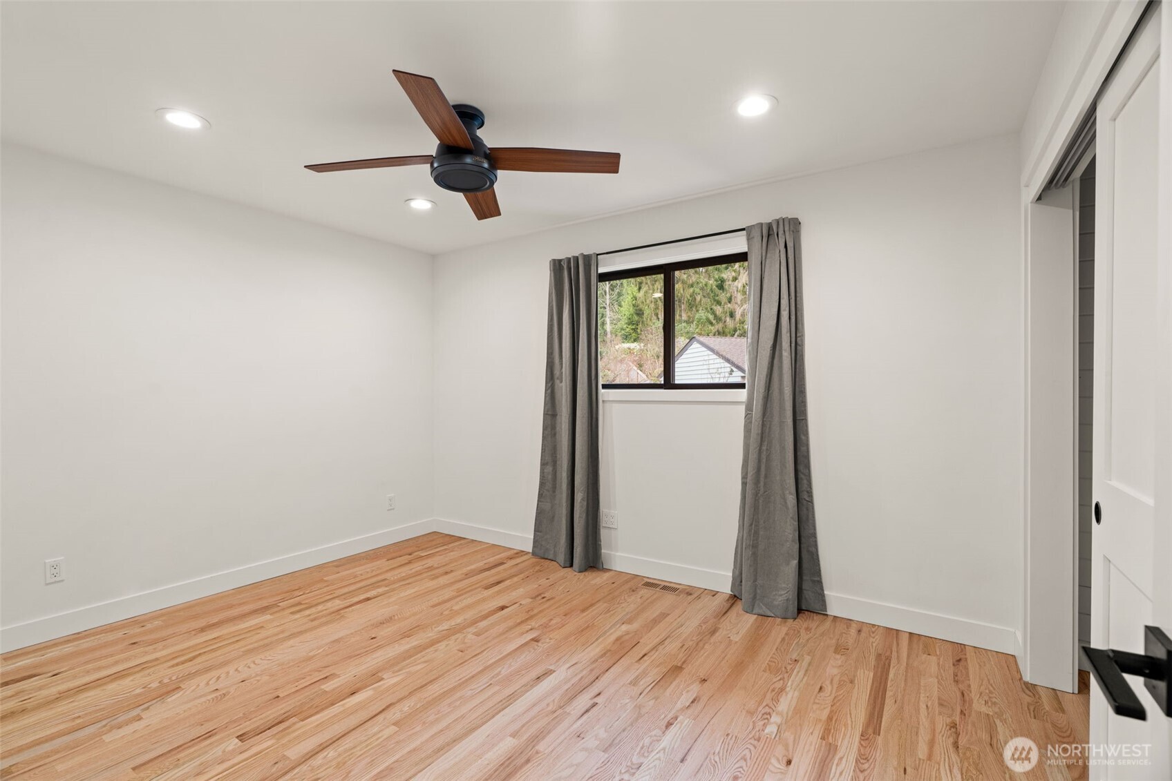 19125 94th Avenue West Edmonds, WA 98020 - Photo 21 of 37 wooden floor in an empty room with a window