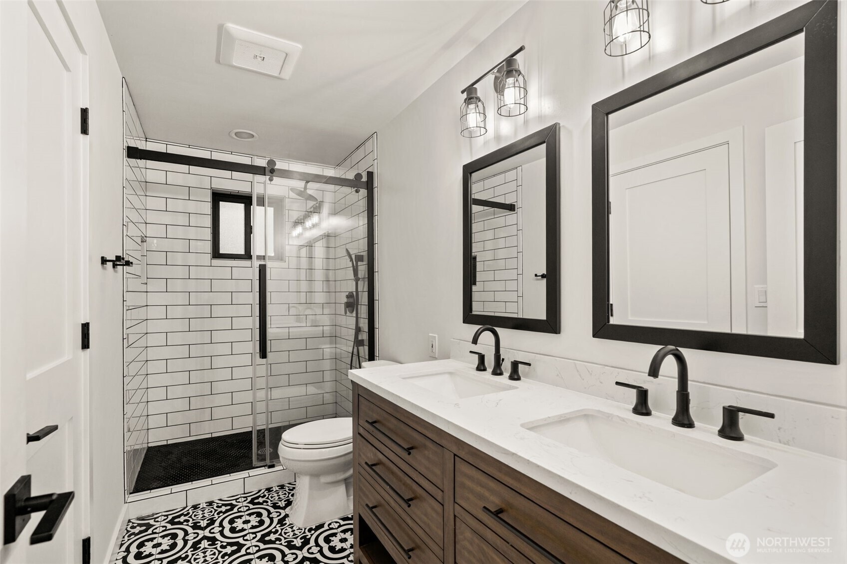 19125 94th Avenue West Edmonds, WA 98020 - Photo 22 of 37 a bathroom with a double vanity sink toilet and shower