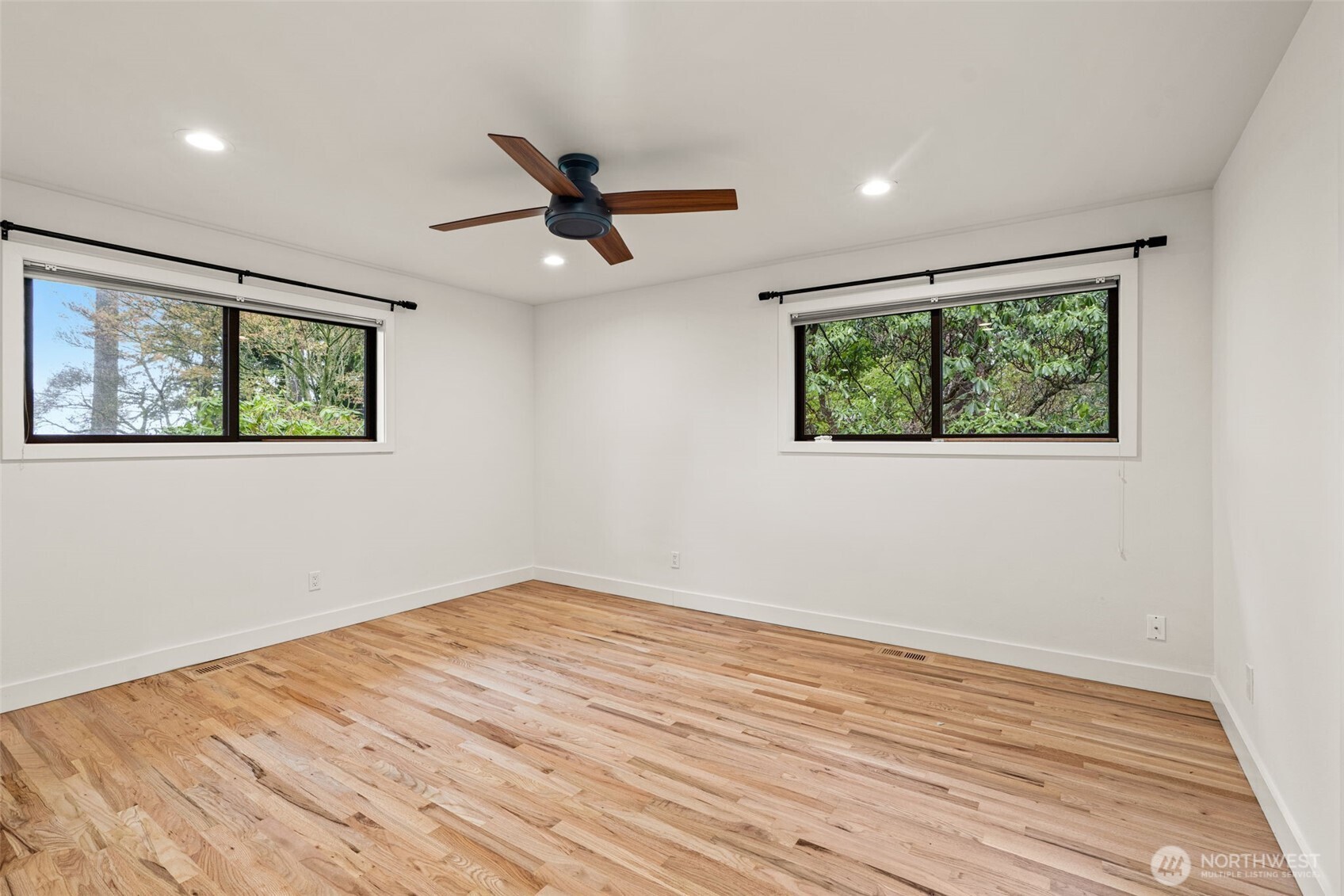 19125 94th Avenue West Edmonds, WA 98020 - Photo 23 of 37 a view of empty room with wooden floor and fan