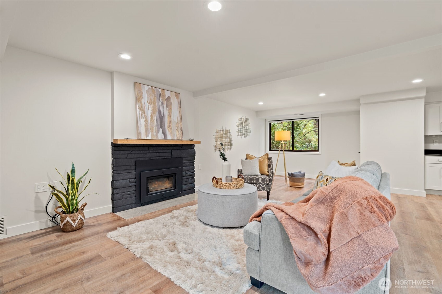 19125 94th Avenue West Edmonds, WA 98020 - Photo 24 of 37 a living room with furniture a fireplace and a potted plant