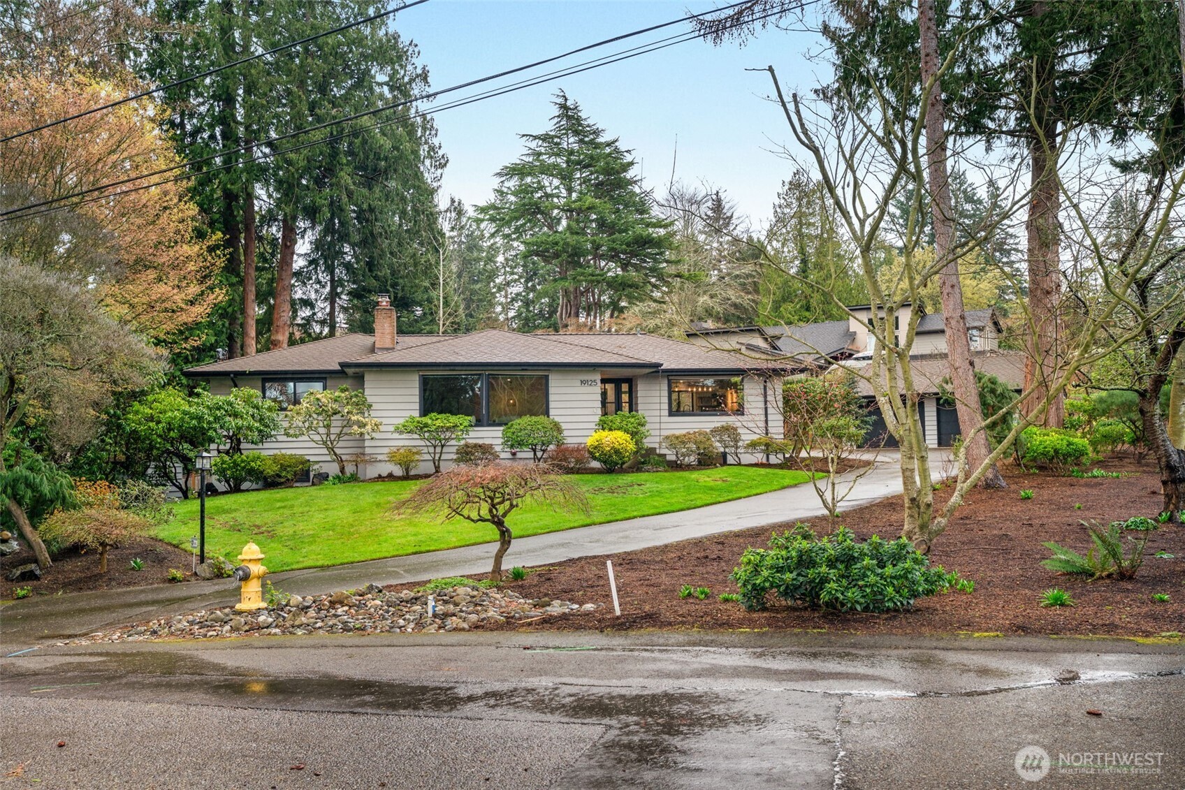19125 94th Avenue West Edmonds, WA 98020 - Photo 4 of 37 a front view of a house with a garden and porch
