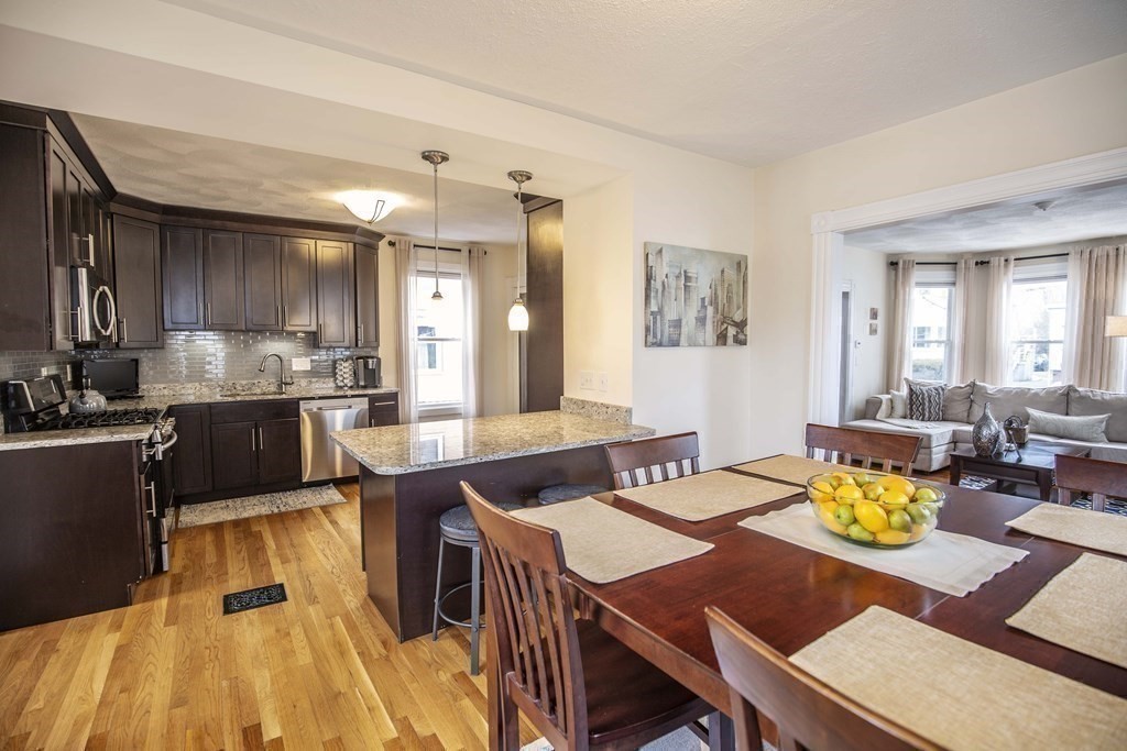 10 Columbus Avenue Saugus, MA 01906 - Photo 11 of 38 a kitchen with a dining table chairs and kitchen view