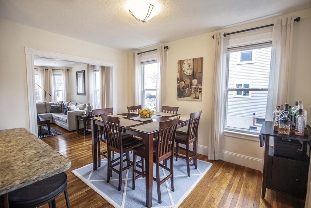 10 Columbus Avenue Saugus, MA 01906 - Photo 12 of 38 a view of a a dining room with furniture window and wooden floor