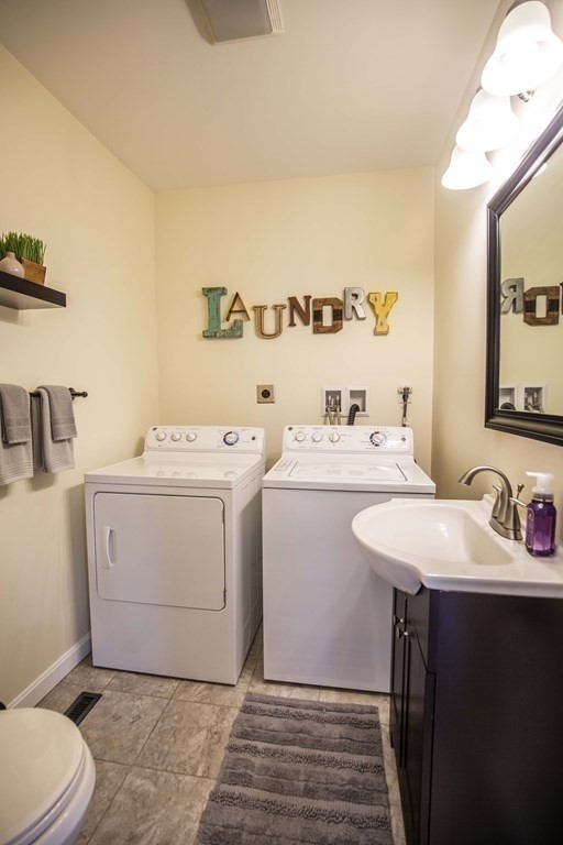 10 Columbus Avenue Saugus, MA 01906 - Photo 17 of 38 a bathroom with a sink toilet and a mirror