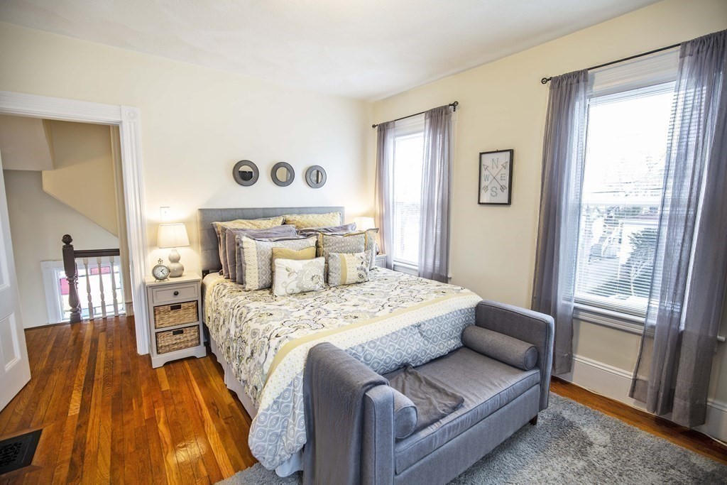 10 Columbus Avenue Saugus, MA 01906 - Photo 20 of 38 a bedroom with a bed and wooden floor