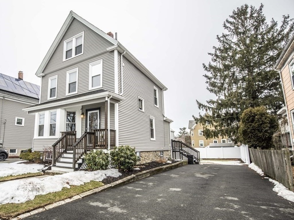 10 Columbus Avenue Saugus, MA 01906 - Photo 2 of 38 a front view of a house with a yard and garage