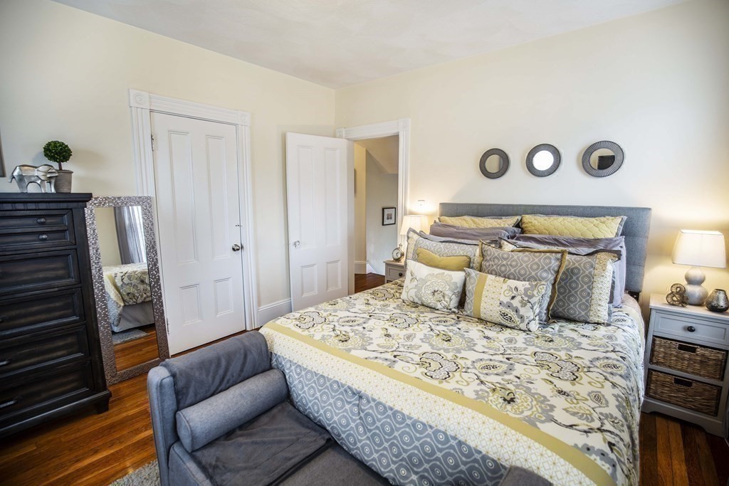 10 Columbus Avenue Saugus, MA 01906 - Photo 21 of 38 a bedroom with a bed and wooden floor
