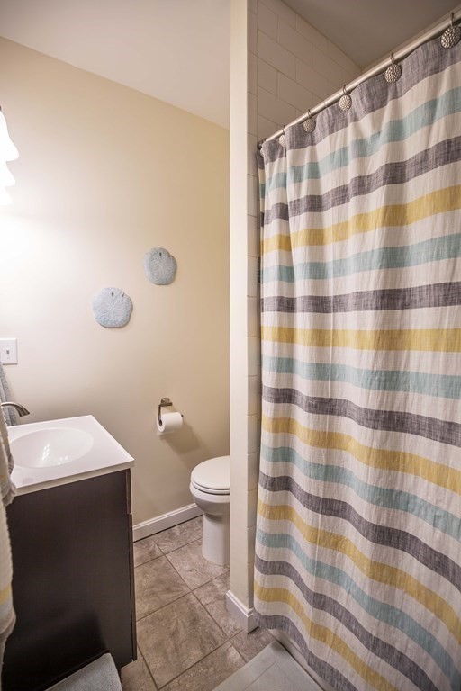 10 Columbus Avenue Saugus, MA 01906 - Photo 23 of 38 a bathroom with a sink toilet and shower