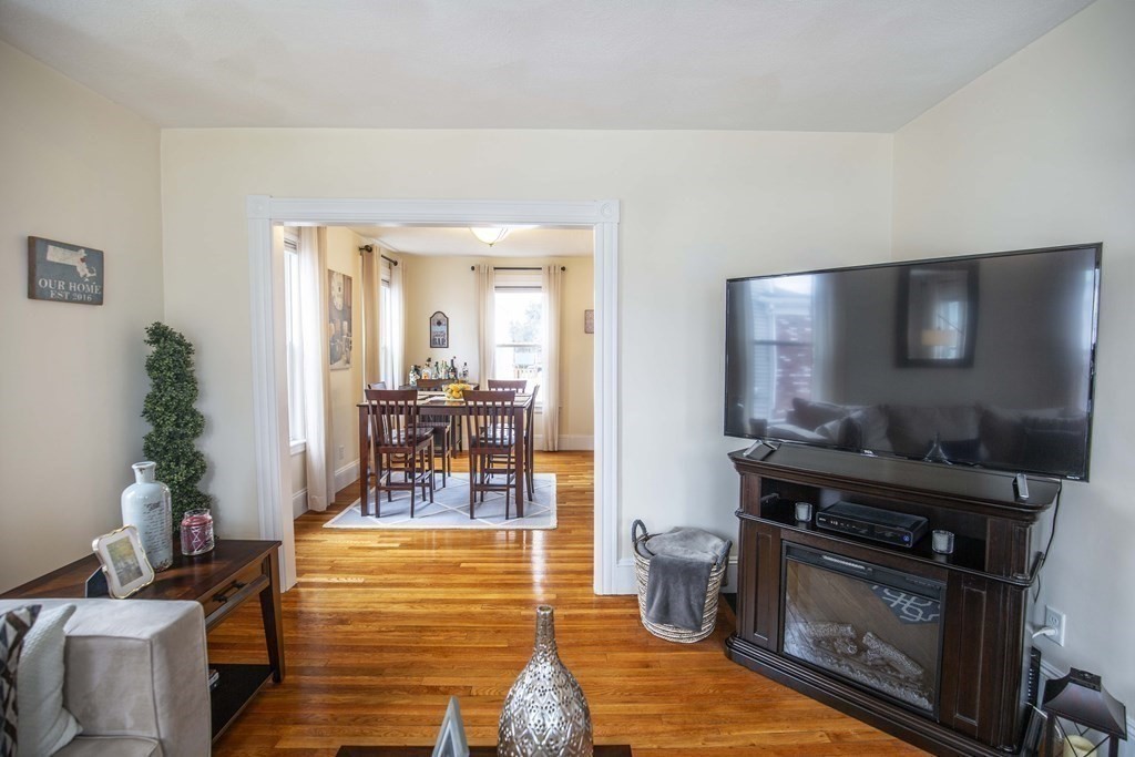 10 Columbus Avenue Saugus, MA 01906 - Photo 8 of 38 a kitchen with a stove and a wooden floor
