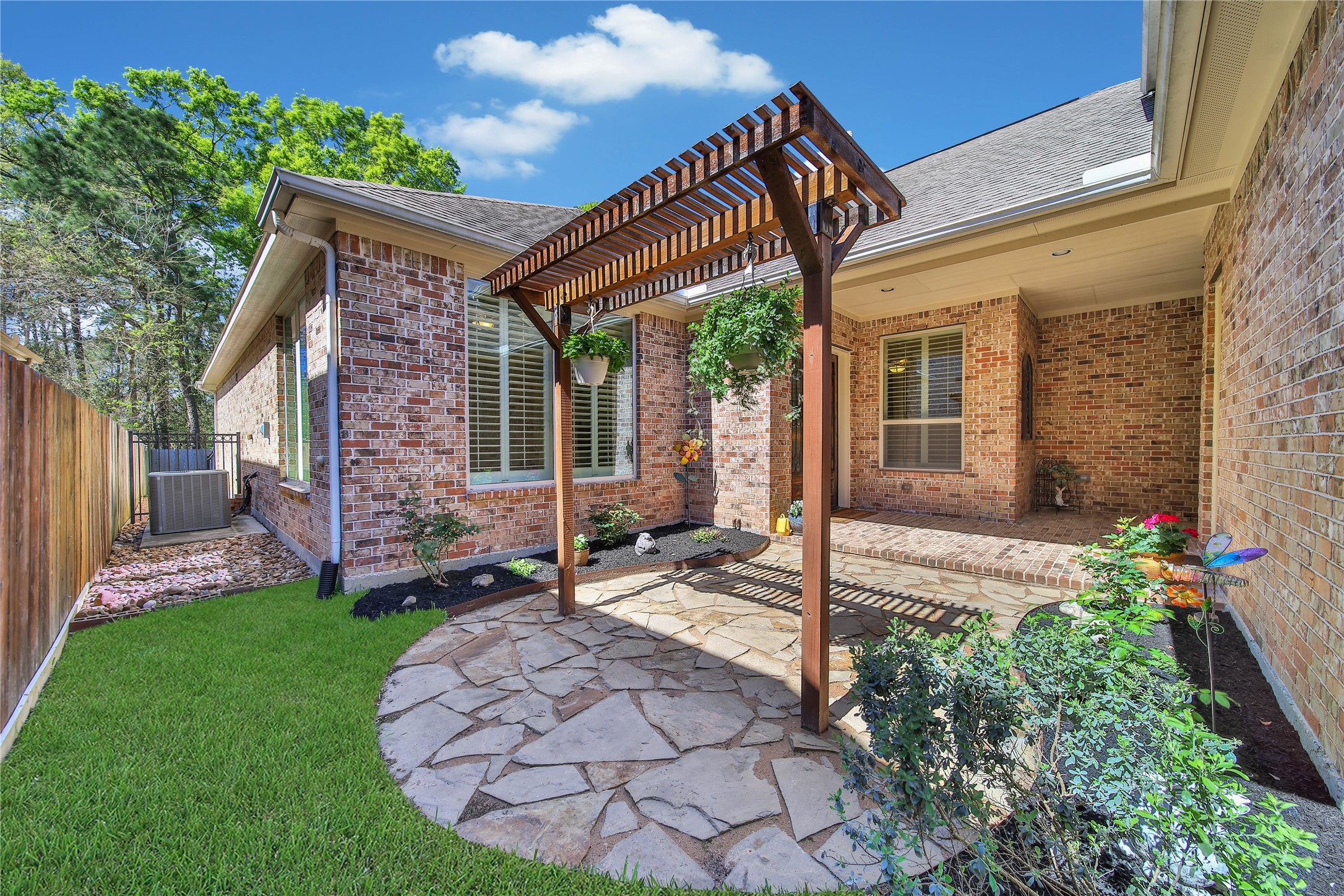 3234 Explorer Way Conroe, TX 77301 - Photo 7 of 46 The private courtyard offers a peaceful outdoor retreat with beautiful architectural details.