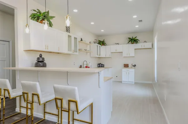 a kitchen with stainless steel appliances cabinets and a refrigerator