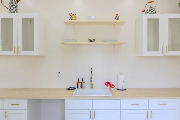 a kitchen with a sink cabinets and appliances