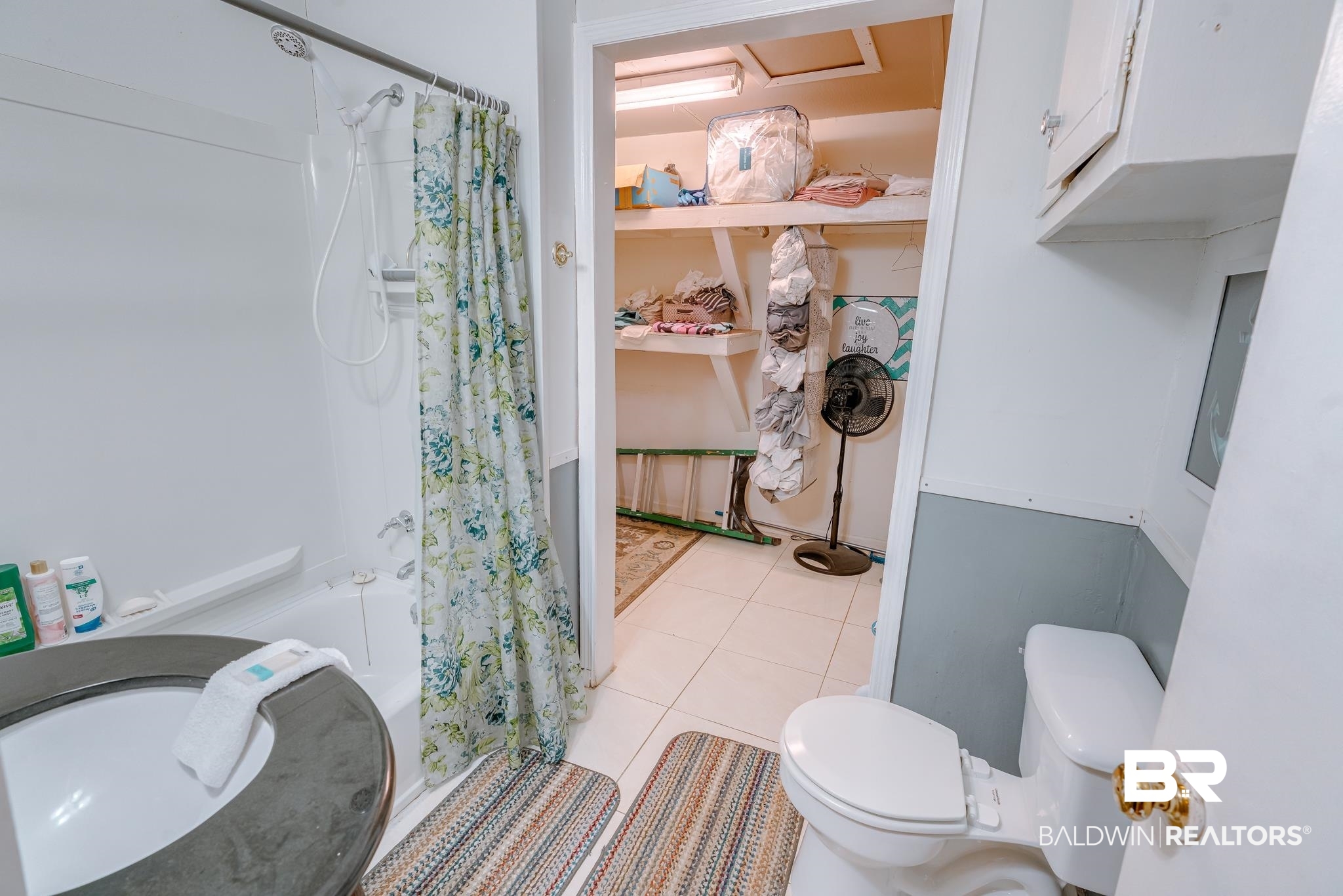 315 Fourth Avenue Chickasaw, AL 36611 - Photo 25 of 28 Full bath featuring toilet, shower / tub combo with curtain, and tile patterned floors