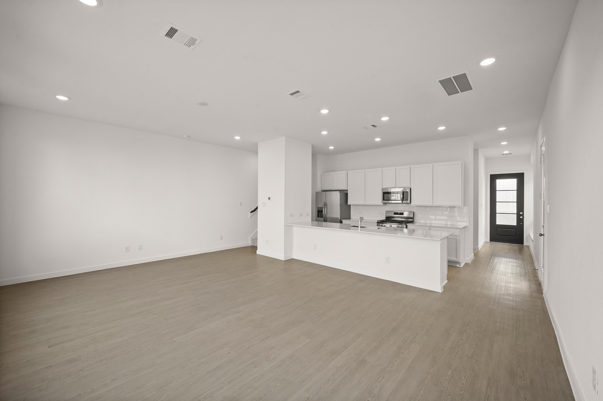 2207 Diagonal Lane Houston, TX 77051 - Photo 22 of 36 a view of a kitchen with kitchen island a sink a stove and a refrigerator