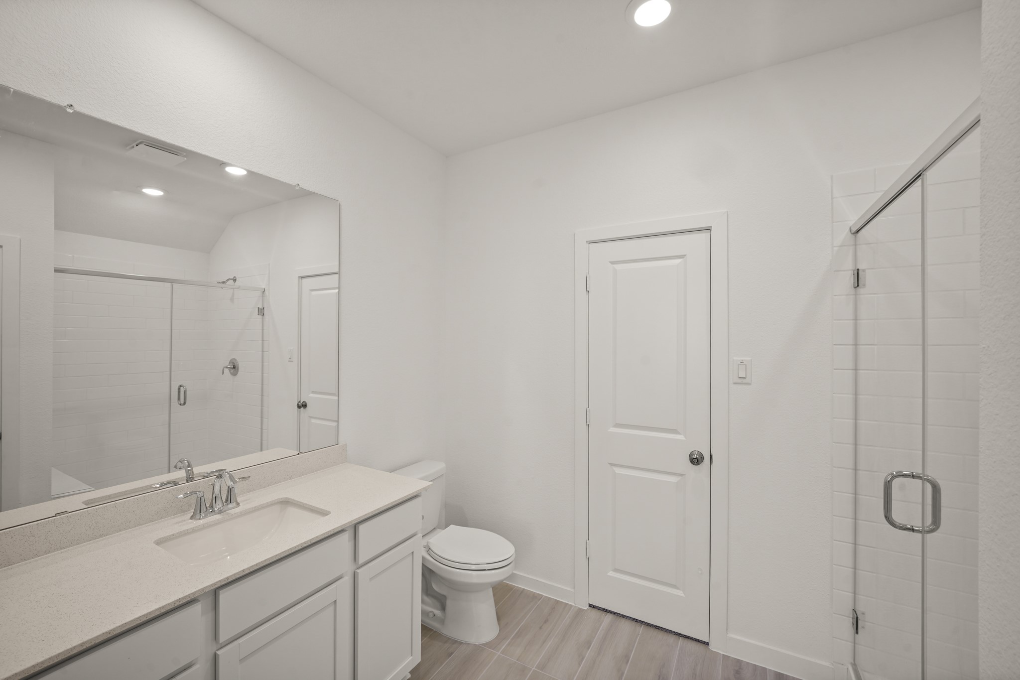 2207 Diagonal Lane Houston, TX 77051 - Photo 7 of 36 a bathroom with a granite countertop sink a toilet and shower