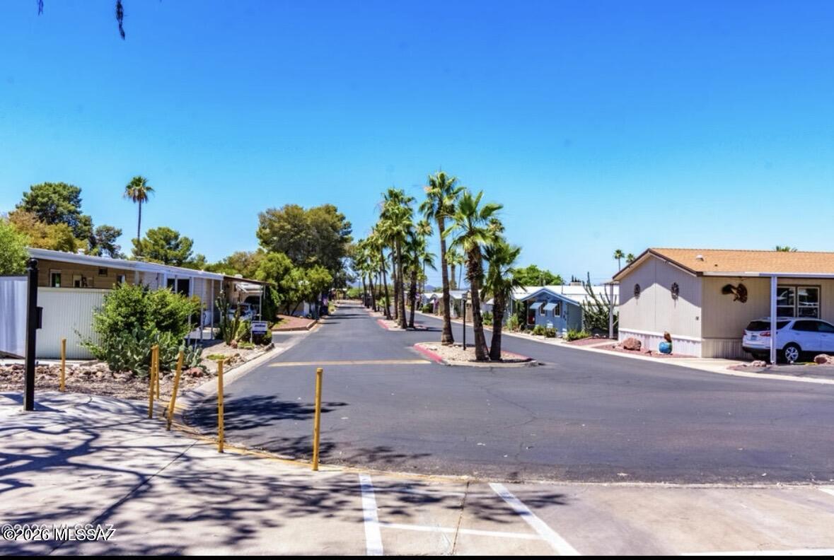 4550 North Flowing Wells Road, Unit 65 Tucson, AZ 85705 - Photo 45 of 50 a view of a street with potted plants
