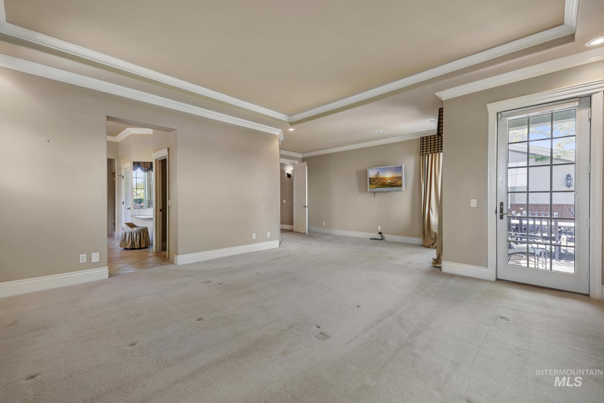 1526 Highway 26 Gooding, ID 83330 - Photo 7 of 48 Unfurnished bed room featuring light colored carpet, crown molding, and plenty of natural light