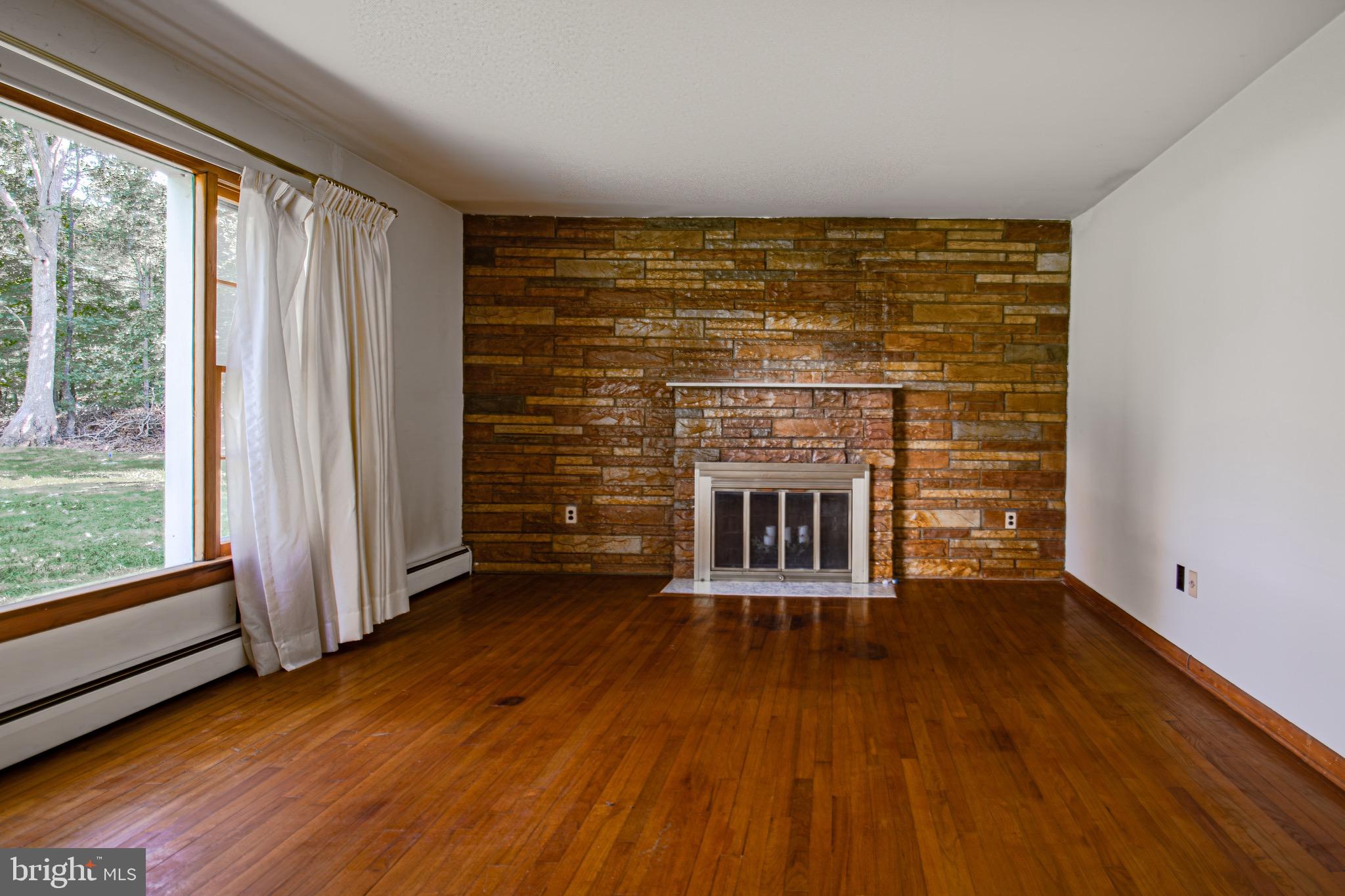 6230 Ripley Road La Plata, MD 20646 - Photo 14 of 30 Living room. Wood burning fireplace