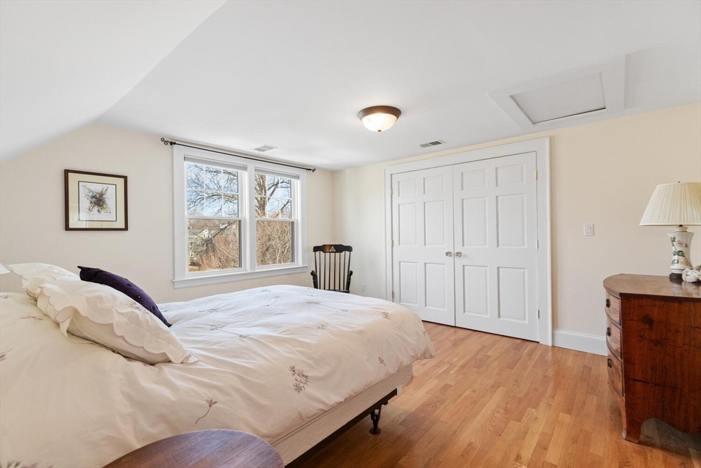 209 Waltham Street Lexington, MA 02421 - Photo 29 of 39 a bedroom with a bed and a window