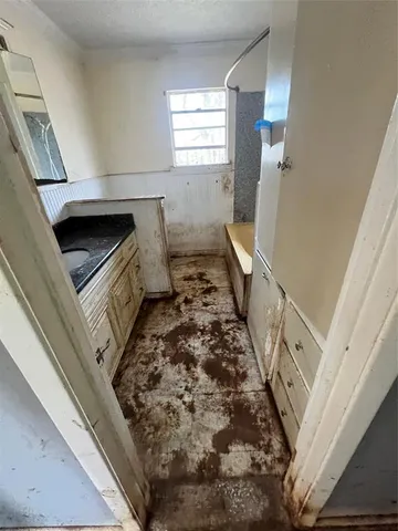 a bathroom with a sink a toilet and a window