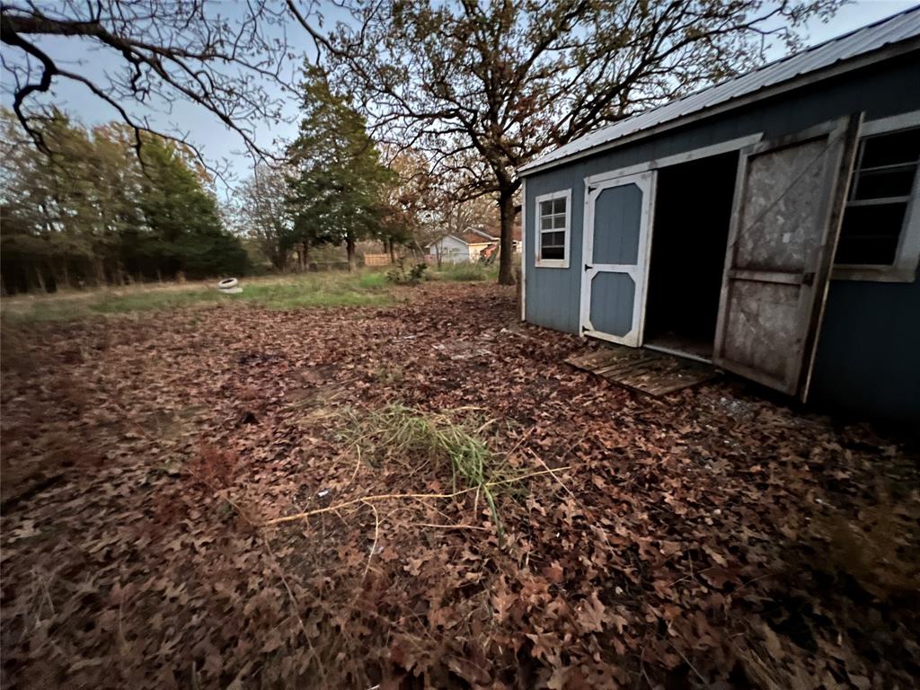 492 Richerson Road Denison, TX 75021 - Photo 19 of 28 a view of a house with a yard