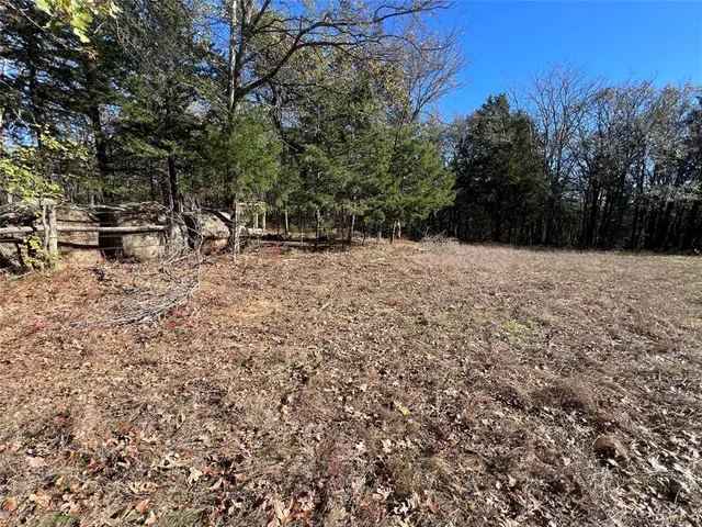a view of empty room with trees