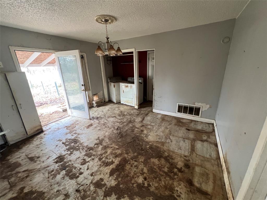 492 Richerson Road Denison, TX 75021 - Photo 9 of 28 a view of a livingroom with a chandelier