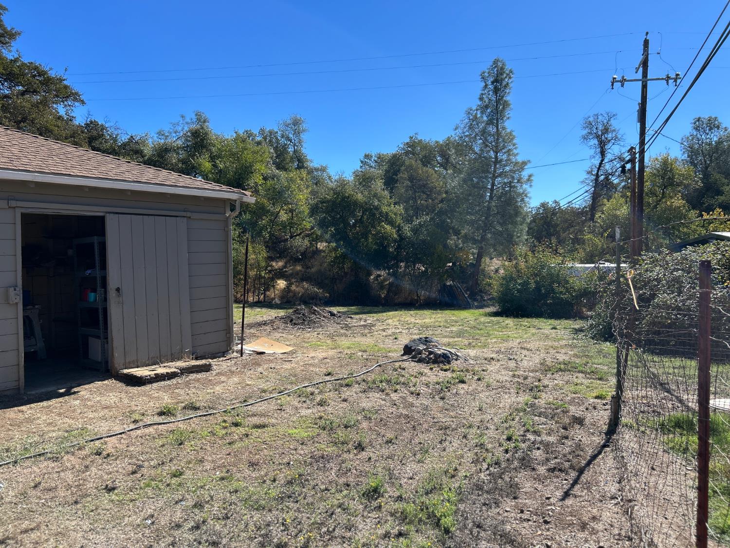 3423 Vallecito Bypass Road Vallecito, CA 95251 - Photo 27 of 37 a backyard of a house with large trees