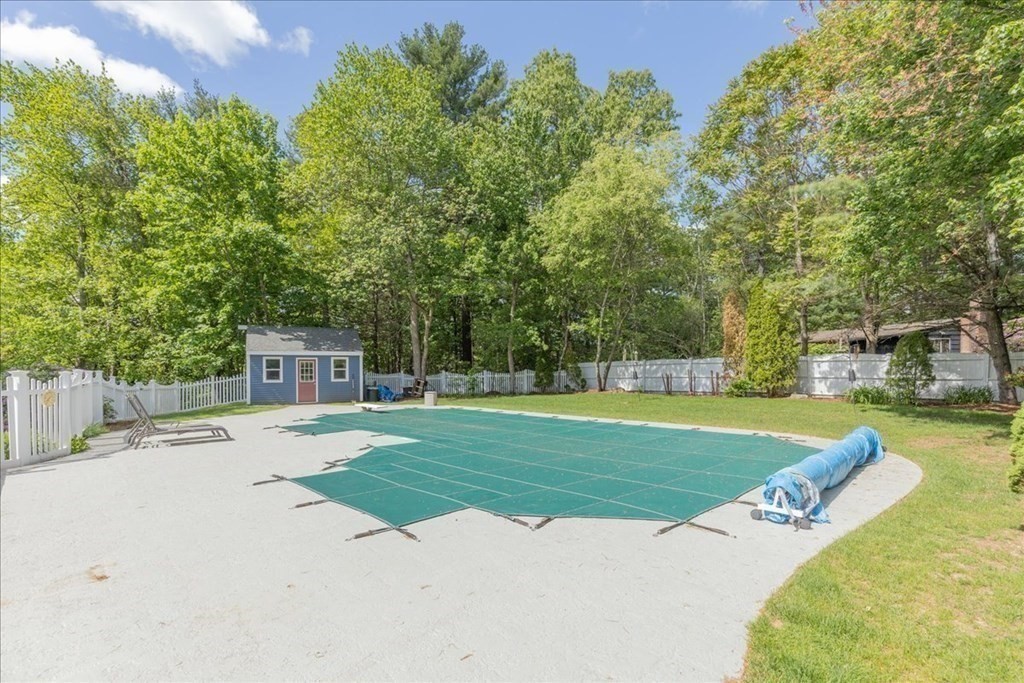 24 Campbell Road Middleton, MA 01949 - Photo 13 of 41 a view of a swimming pool with a patio